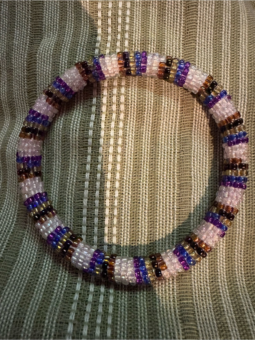Nogu glass beaded roll on  Bracelet in Pink, Purple, and Brown